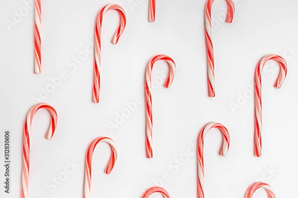 Fototapeta red and candy cane on white background
