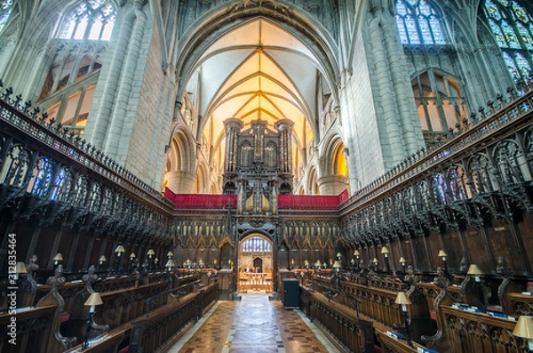 Obraz Great organ in Gloucester Cathedral UK high up between the choir and the nave 