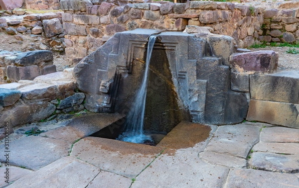 Obraz A fountain ruins carved in stone  called the bath of the princess, Ollantaytambo Archaeological Park, Peru