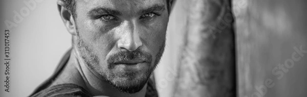 Fototapeta Handsome and fit Caucasian male on the beach