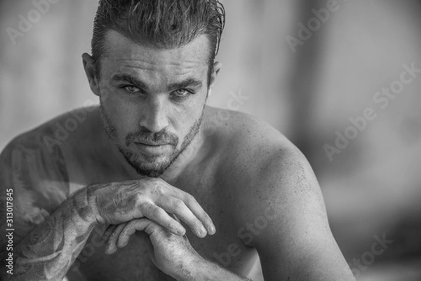 Fototapeta Handsome and fit Caucasian male on the beach