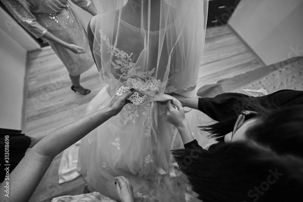 Obraz bride and groom holding hands