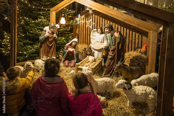Fototapeta Czestochowa, Poland, January 1, 2020: Children in front of the Christmas stable in the cathedral at Jasna Góra in Czestochowa