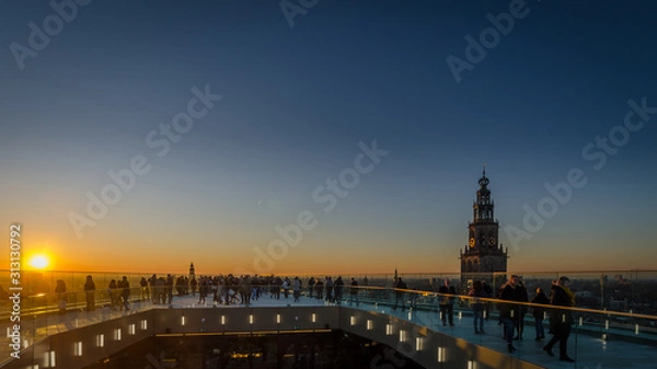 Fototapeta GRONINGEN - NETHERLANDS, December 30, 2019: The new Forum building, a landmark, in the city of Groningen. View from the roof during sunset