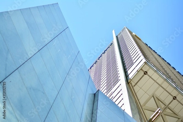 Fototapeta The windows of a modern building for offices. Business buildings architecture.