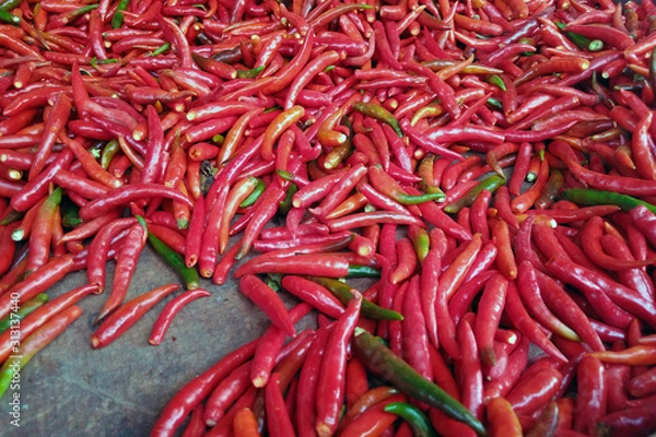 Fototapeta Many spicy red chili peppers on table