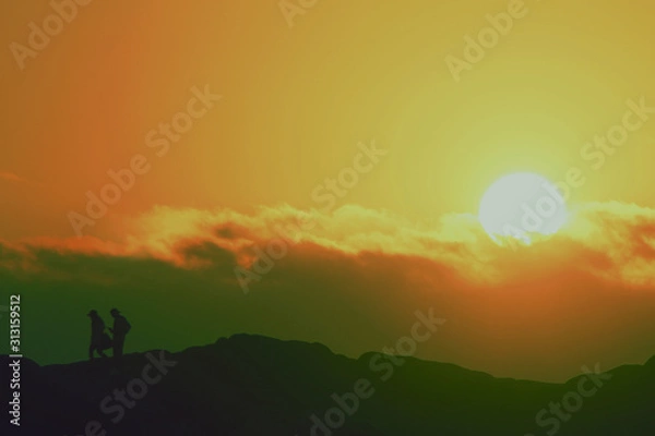 Fototapeta sunset over green field