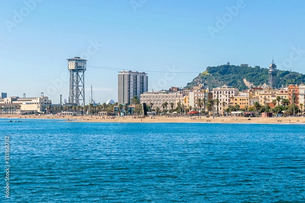 Fototapeta  The aerial tramway with its two towers,  Torre Sant Sebastia and Torre Jaume I in Barcelona, Spain