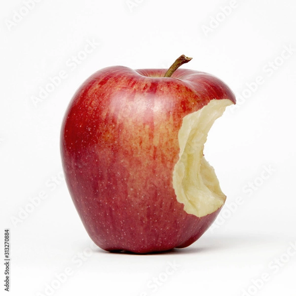 Fototapeta Red apple with a bite out of it, isolated on a white background