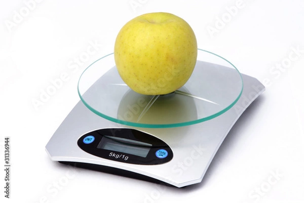 Obraz Apple on weighing machine