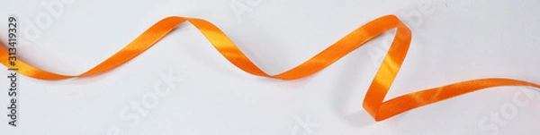 Fototapeta Orange ribbon isolated on white background