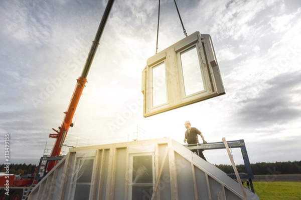 Fototapeta Construction of a Single Family Home with the Help of a Crane