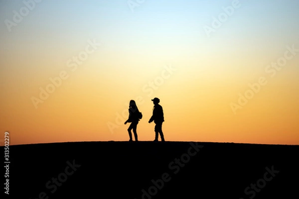 Fototapeta Two People Walking