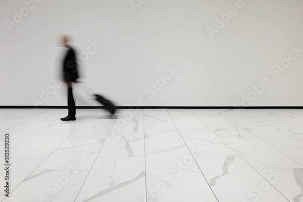 Fototapeta isolated blurred person with trolley