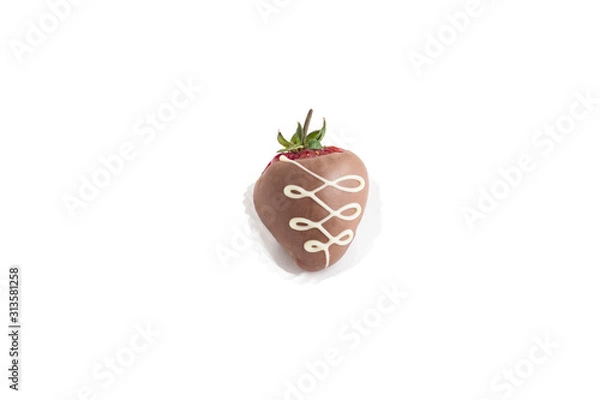 Fototapeta ripe red strawberries in dark chocolate with patterns in a paper basket isolated on white background