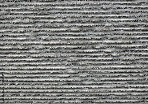Fototapeta close-up pattern of a concrete wall with broad horizontal lines exposed