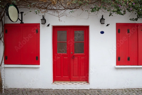 Obraz Exterior of authentic houses and colorful wooden shutters in Sigacik village, Izmir city, Turkey.