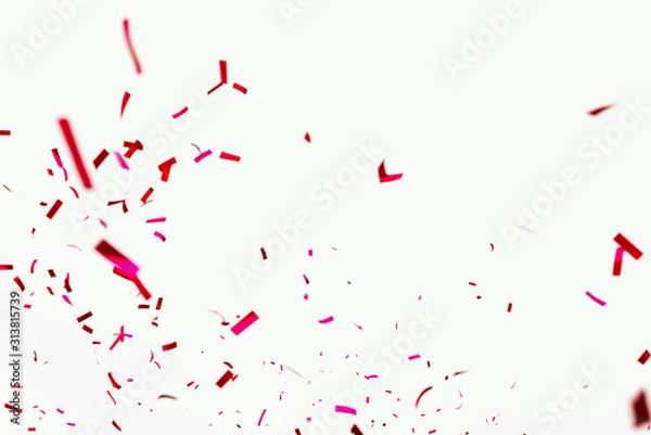Fototapeta Confetti explodes on a white background. Festive salute of shiny red paper. Background decoration for a holiday, party, birthday or anniversary. Pieces and scraps of red ribbon