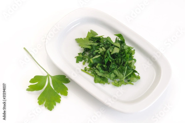 Fototapeta Chopped parsley on a tray