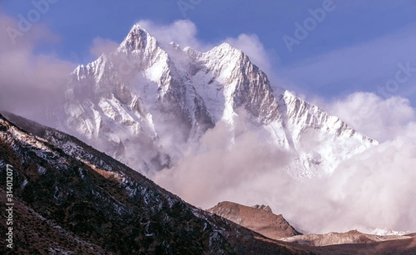 Fototapeta Greatness of nature concept: grandiose view of Lhotse peak (8516 m) at sunset. The third highest peak in the world after Everest and K-2 peaks; Nepal, Himalayas