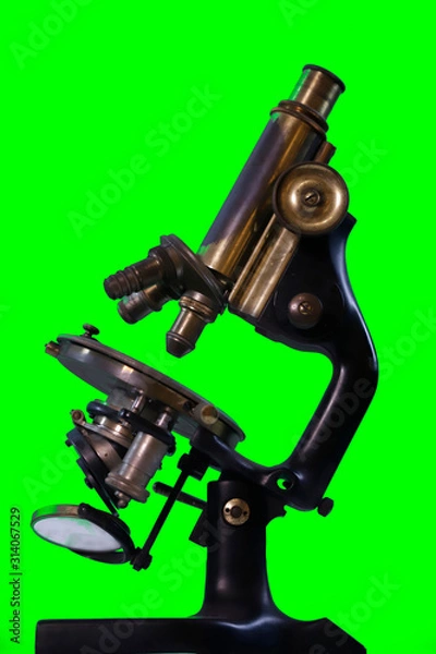 Fototapeta Old microscope - green background for alpha