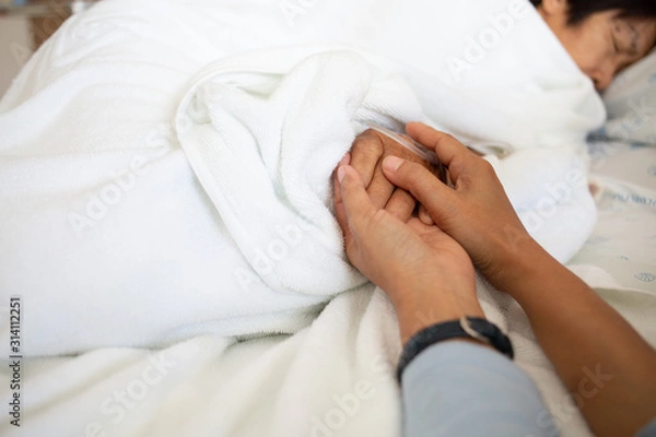 Fototapeta nurse's hands are encouraging the patient to have life support.