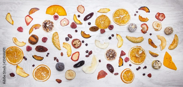 Obraz panoramic composition of dried fruits on a white background