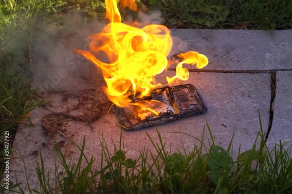 Fototapeta Burning smartphone, burning mobile phone