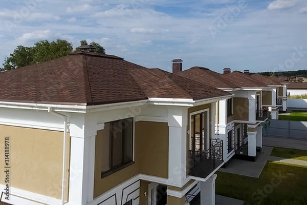Fototapeta Bituminous tile for a roof. House with a roof from a bituminous