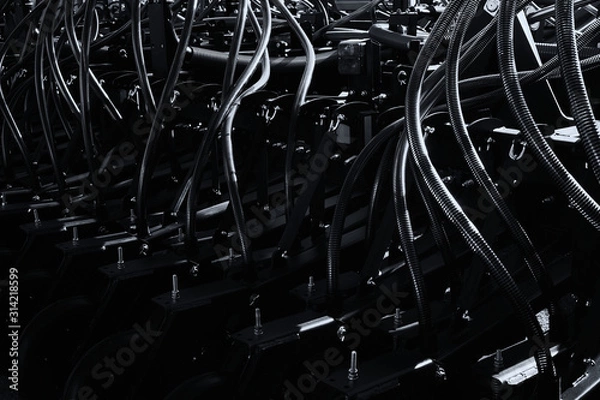 Fototapeta Modern high-precision seeder. Row seeder. Black and white image.