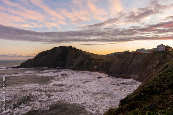 Fototapeta The coast of Zumaia a cloudy day at dawn