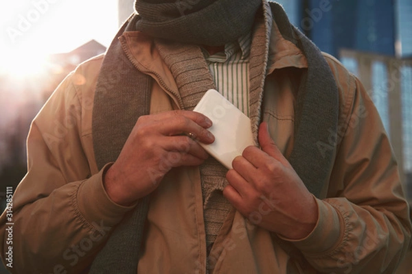 Obraz Handsome man using cellphone while enjoying in Paris.