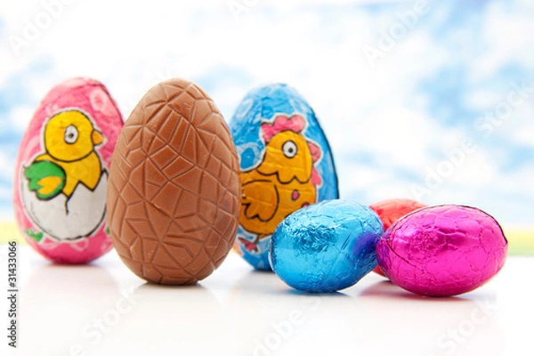 Obraz Colorful chocolate easter eggs over white background