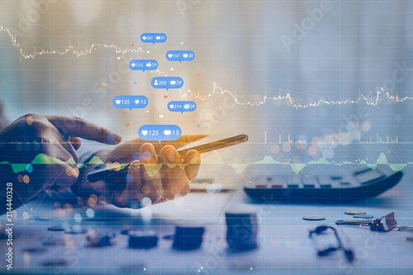 Obraz Double exposure of businessman using a social media marketing concept with notification icons with Investors are calculating on calculator investment costs, business finance concept.