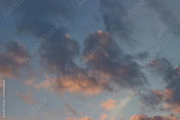 Obraz dark thunderclouds lit by the setting sun