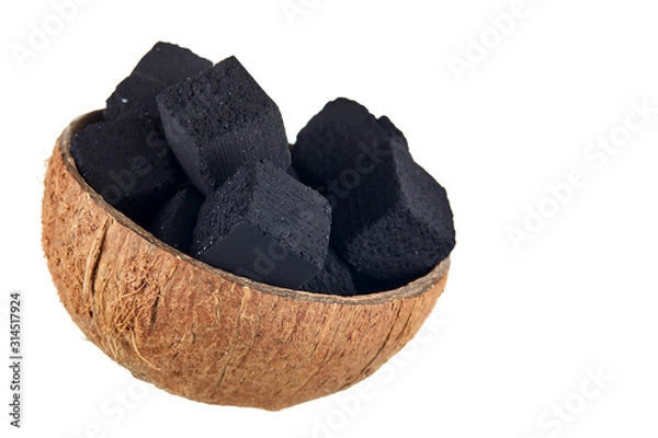 Fototapeta Coconut charcoal on a white background. Coconut coal cubes for hookah and coconut close-up. Side view.