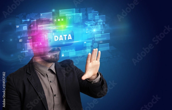 Fototapeta Businessman looking through Virtual Reality glasses with DATA inscription, innovative security concept