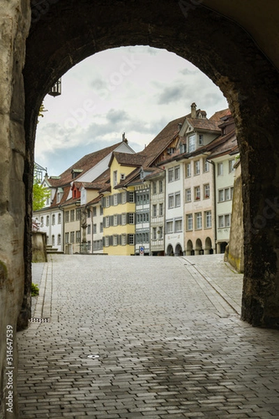 Fototapeta Under the gate to historic city center in Wil, Switzerland