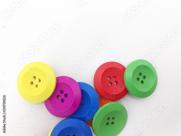 Fototapeta Various Bright Colorful Handmade Cute Shirt Button for Tailor Clothing Accessories in White Isolated Background 