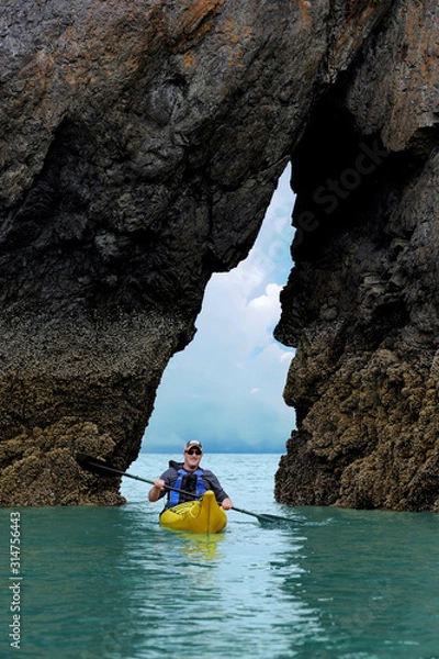 Obraz man kayaking between rocks, Alaska