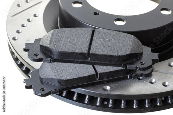 Obraz brake discs and pads on a white background