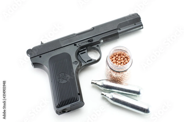 Fototapeta  Black air gun. Two cylinders of CO2 and a can of bullets. Copy of the pistol of the armed forces of the USSR.
