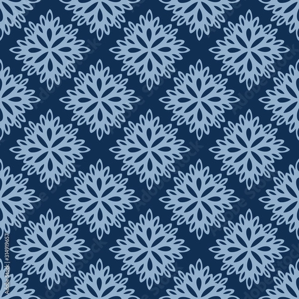Fototapeta Seamless vector pattern of lacy paper flowers on classic blue background. Pretty hand drawn elements resembling paper cut outs can used as a backdrop, background, textile, paper and more.