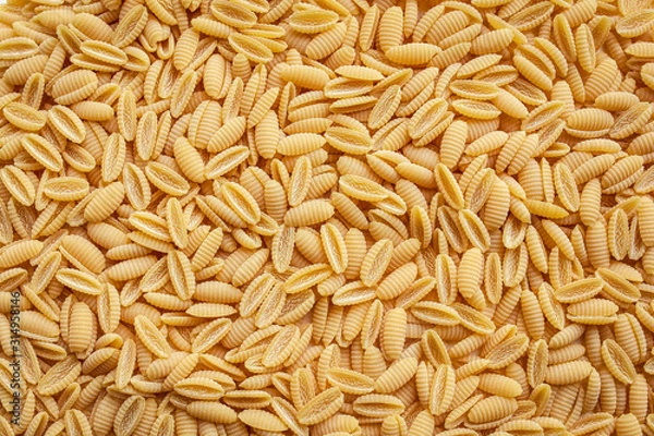 Fototapeta Fusilli pasta background. Seamless pattern. 