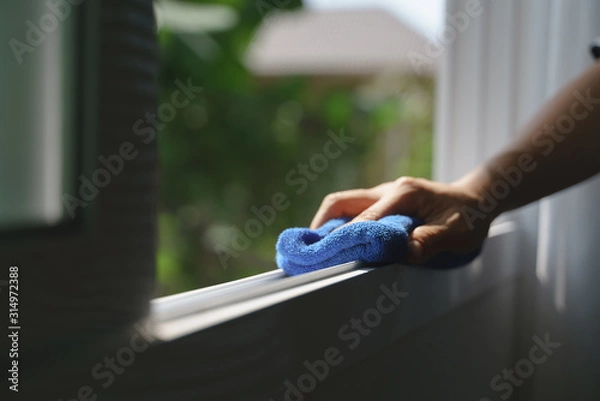 Obraz Hand holding microfiber cloth for cleaning