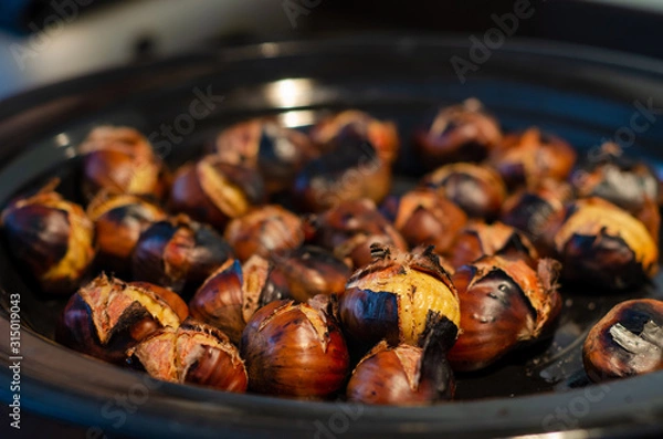 Obraz Roasting chestnuts on the pan
