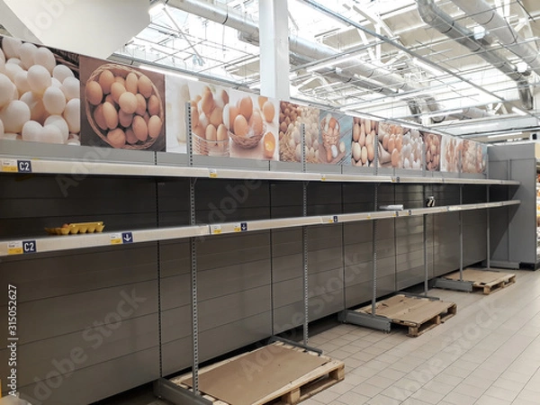 Obraz empty shelves in the Department store with eggs, empty shelves in the store after the holidays