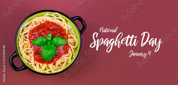 Fototapeta National Spaghetti Day images. Spaghetti pasta with tomato sauce on a brown background stock images. Spaghetti with basil on a brown background. Pasta top view banner