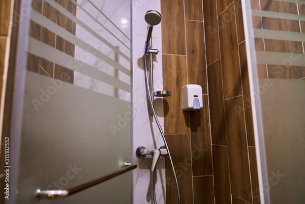 Fototapeta Shower in the spa or in the gym, shower with frosted glass doors
