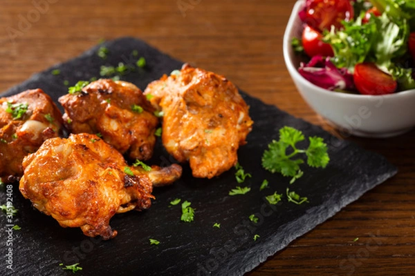 Fototapeta Roasted chicken drumsticks